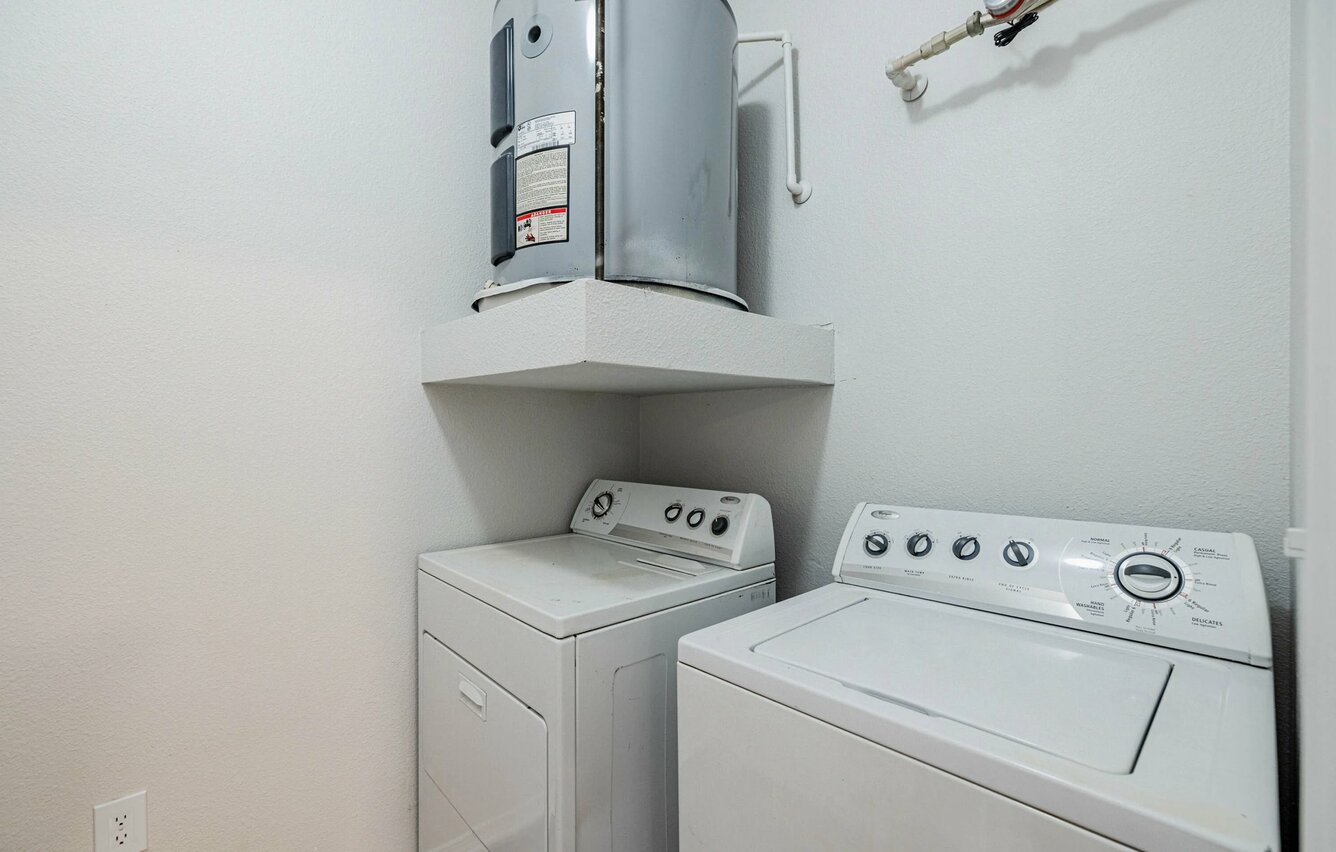 Laundry room at Arioso Apartments & Townhomes